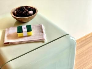 a bowl of chocolate and a napkin on a table at Green Man Gerês Mountain House in Campo do Gerês +14 photos