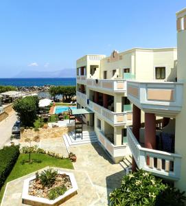 an apartment building with a view of the ocean at Aphrodite Beach in Kissamos