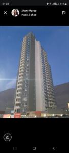 a view of a large building with a picture of it at departamento cercano a mall zofri in Iquique