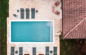 an overhead view of a swimming pool next to a house at Villa Montona in Višnjan