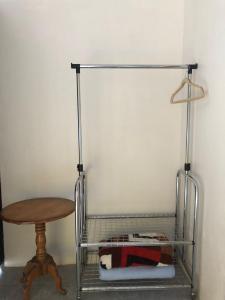 a metal rack with a table and a table at Lissadell Country House in Monteverde Costa Rica