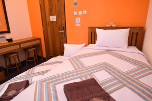 Letto o letti in una camera di The Cabin Hotel Mantrijeron