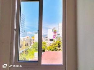 a window with a view of a city at Q.MIN apartment in Nha Trang