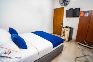 Postel nebo postele na pokoji v ubytování Hotel Casa 10