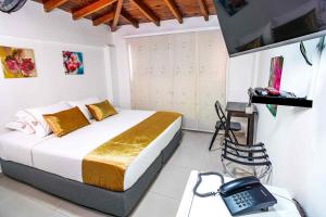 TV a/nebo společenská místnost v ubytování Hotel Casa 10
