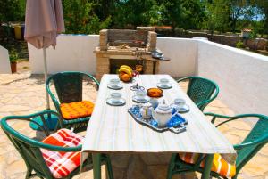 a table with a tea set on top of it at House Soni - 800 m from the sea in Rovinj