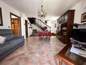 a living room with a couch and a table at Baita pressi Gran Paradiso in Sparone