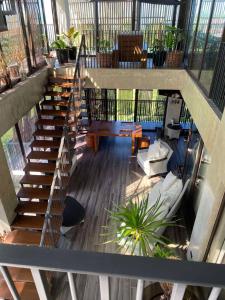 a staircase in a building with a living room at Brisa de Cristal at Canyon Cove Nasugbu Batangas in Nasugbu