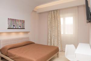 Säng eller sängar i ett rum på Casa Gaia