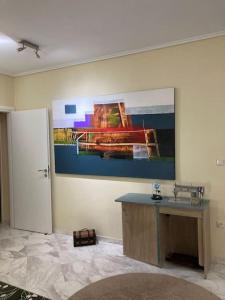 a room with a sink and a painting on the wall at Modern House 