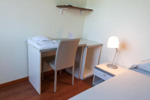 Postel nebo postele na pokoji v ubytování Hotel L'Approdo