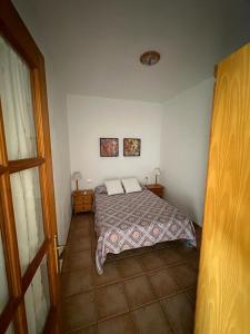 a bedroom with a bed with two pillows on it at Casa Jesus in Fuencaliente de la Palma