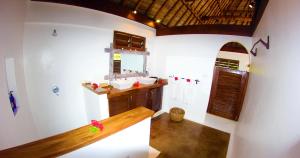 a bathroom with a sink and a mirror at Navutu Stars Resort in Matayalevu