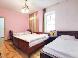 Een bed of bedden in een kamer bij Guest House LALI