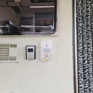 a door of a caravan with a sign on it at Louise´s Camper in Neusiedl an der Zaya +15 photos