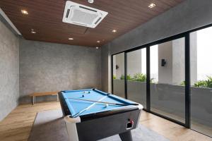 a billiard room with a pool table in it at Modern & Minimalist 2-Bedroom Apartment in PJ in Petaling Jaya