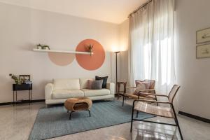 a living room with a couch and chairs at A Tutto Tondo Apartment - Comfort and Style in Lerici in Lerici