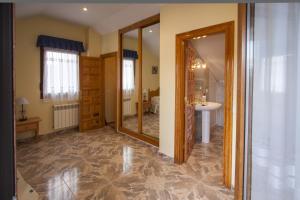 a bathroom with a sink and a mirror at Apartamentos La Bolera in Isla