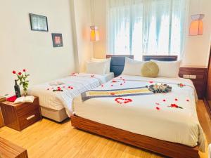 Rúm í herbergi á Elite Central Hotel Hanoi