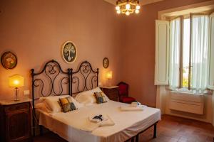 Posteľ alebo postele v izbe v ubytovaní Agriturismo Villa Ulivello in Chianti