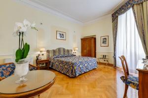 Voodi või voodid majutusasutuse Hotel Cellini toas