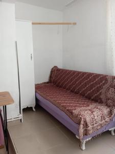 a bed sitting in a corner of a room at single room, in Üsküdar in Istanbul