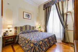 Voodi või voodid majutusasutuse Hotel Cellini toas