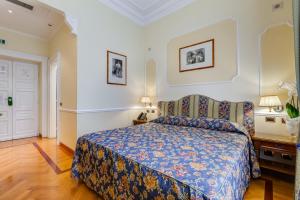 Voodi või voodid majutusasutuse Hotel Cellini toas