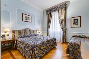 Voodi või voodid majutusasutuse Hotel Cellini toas