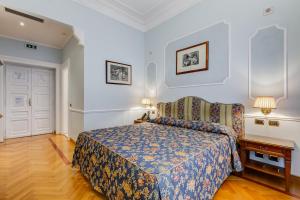 Voodi või voodid majutusasutuse Hotel Cellini toas