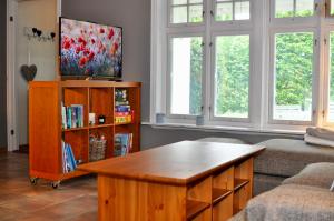 a living room with a coffee table and a couch at Seaside Comfort with Terrace - Business and Leisure Friendly in Tønsberg