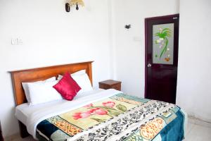 Pedro Resort & Bungalow Nuwara Eliya tesisinde bir odada yatak veya yataklar