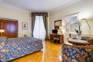 Voodi või voodid majutusasutuse Hotel Cellini toas