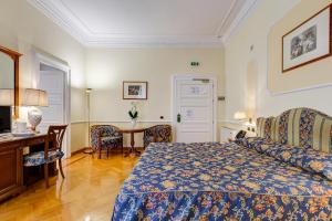 Voodi või voodid majutusasutuse Hotel Cellini toas