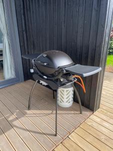 a grill sitting on a table on a deck at Amma Jóna in Hvolsvöllur