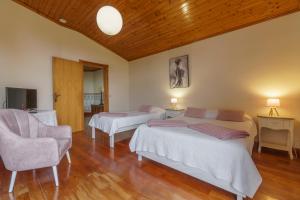 Postel nebo postele na pokoji v ubytování Quinta das Hortências + 37 fotografií