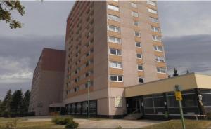 a large brown building with a lot of windows at CrisAnd 3 Panoramic in Altenau