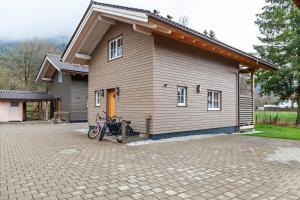 a motorcycle parked in front of a house at Chalet Rauschn 3 in Farchant