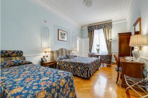 Voodi või voodid majutusasutuse Hotel Cellini toas