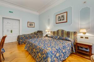 Voodi või voodid majutusasutuse Hotel Cellini toas