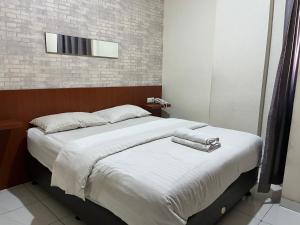 Cama ou camas em um quarto em CVS The Hotel