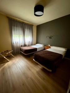 Postel nebo postele na pokoji v ubytování Apartamentos Turisticos Poblado
