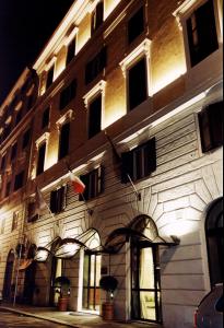 a building with a flag on the side of it at Hotel Windrose in Rome