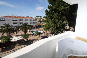a balcony with a view of a street and buildings at Goren Hotel in Çeşme