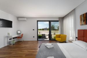 Postel nebo postele na pokoji v ubytování Villa Anni + 37 fotografií