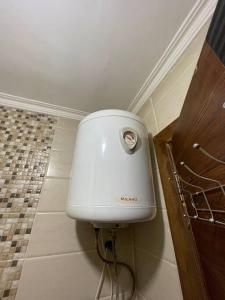 a water tank in the corner of a bathroom at apartment 60m 1bedroom for rent3 in Umm Uthainah