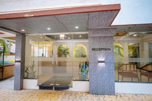 a store front with aidium sign in the window at Kay's Calangute Resort Service Apartments in Calangute