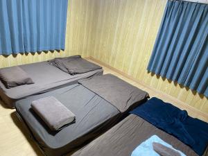 Takeyashiki たけやしき客房内的一张或多张床位