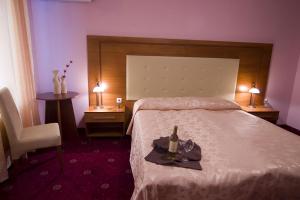 Voodi või voodid majutusasutuse Arena Tarnovo Hotel toas