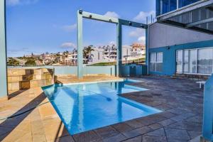 a swimming pool on the roof of a building at Nautical views in Mossel Bay
